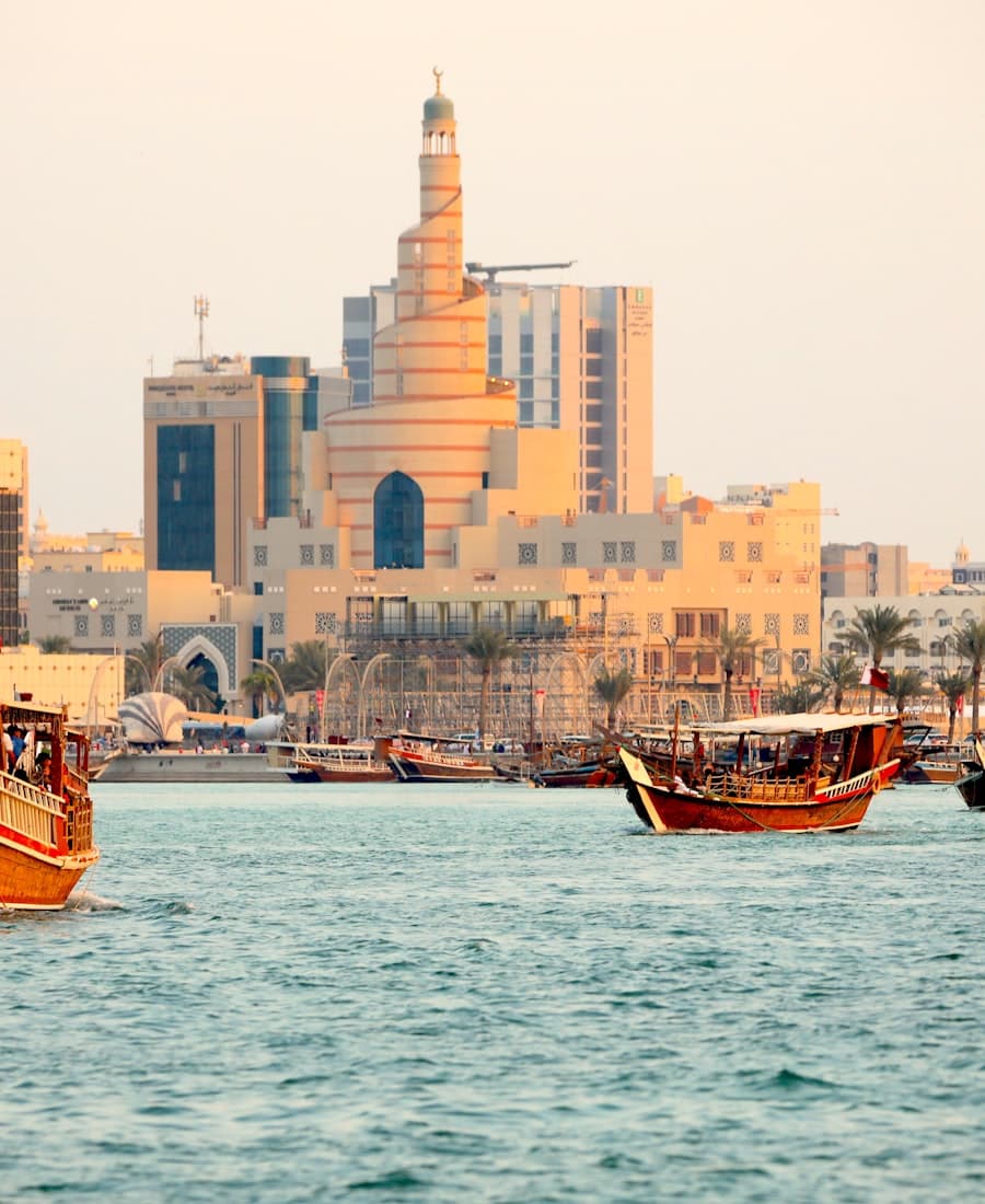 Dhows on the water before Doha's spiral mosque